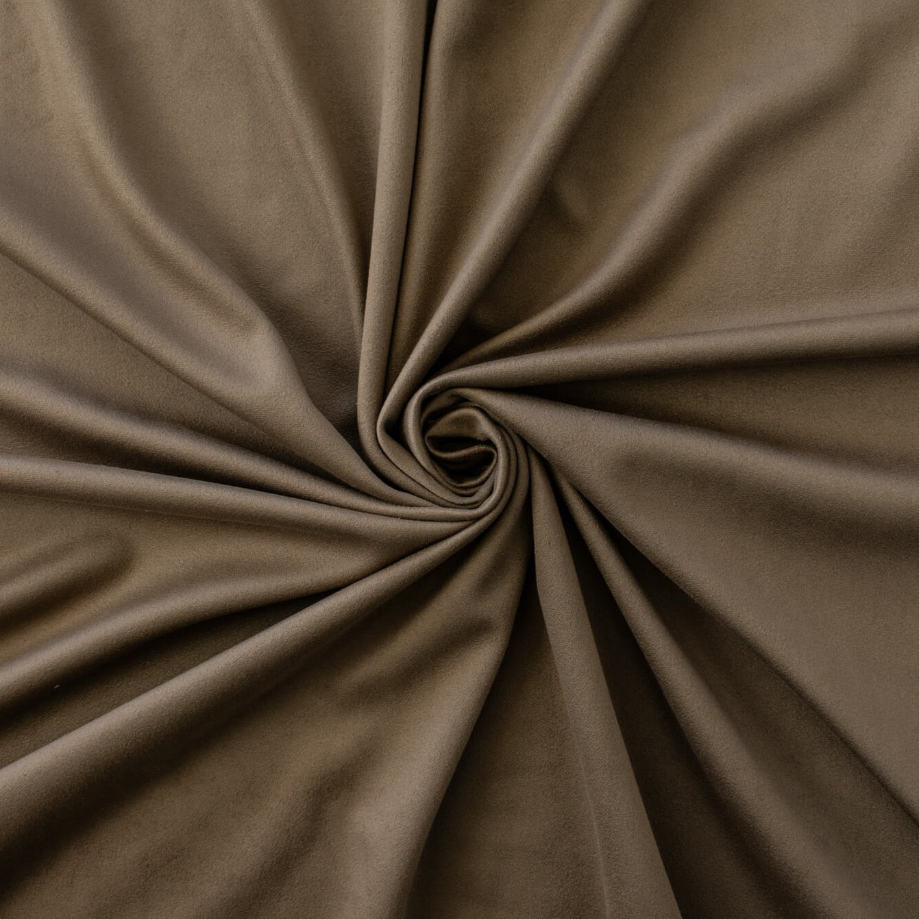 Take your projects up a notch with our Faux Suede Knit fabric by the yard in a soft brown we call "Haute Chocolate". Luxuriously smooth and endlessly fabulous, it's the perfect fabric to add a subdued edge to your "Haute" look! Image of fabric fullness.