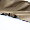 Take your projects up a notch with our Faux Suede Knit fabric by the yard in a soft brown we call "Haute Chocolate". Luxuriously smooth and endlessly fabulous, it's the perfect fabric to add a subdued edge to your "Haute" look! Image of selvedge edge.