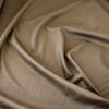 Take your projects up a notch with our Faux Suede Knit fabric by the yard in a soft brown we call "Haute Chocolate". Luxuriously smooth and endlessly fabulous, it's the perfect fabric to add a subdued edge to your "Haute" look! Close up image