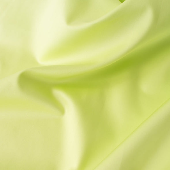 Have some fun in this delightful soft lime green cotton sateen fabric by the yard. Perfect when you want to add a bit of pizzazz to your outfit. The soft lightly brushed hand with the slightest sheen would sew up a lovely shirtdress, &nbsp;jacket or ankle length pant! Close up image