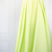 Have some fun in this delightful soft lime green cotton sateen fabric by the yard. Perfect when you want to add a bit of pizzazz to your outfit. The soft lightly brushed hand with the slightest sheen would sew up a lovely shirtdress, &nbsp;jacket or ankle length pant! Image of fabric drape.