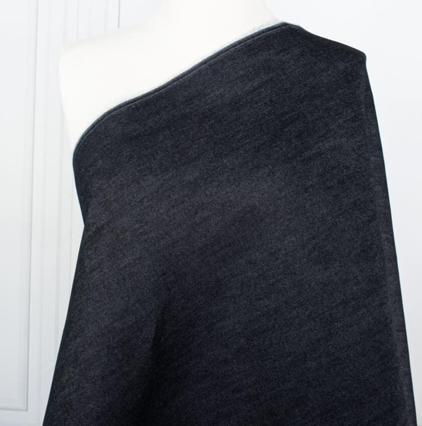 Get the perfect blend of comfort and style with our Midnight Navy Cotton Stretch Denim Twill fabric by the yard. &nbsp;A denim you can dress up with its deep rich dark blue color and crisp, semi-textured hand. Close up image of fabric on dressform.
