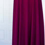 Famous Designer Poly/Spandex ITY Knit in 'Berry Rich'! This designer deadstock fabric by the yard boasts a rich berry color that is sure will elevate any project. Its smooth hand and elegant drape is a must have for comfort and style. Image of fabric drape.