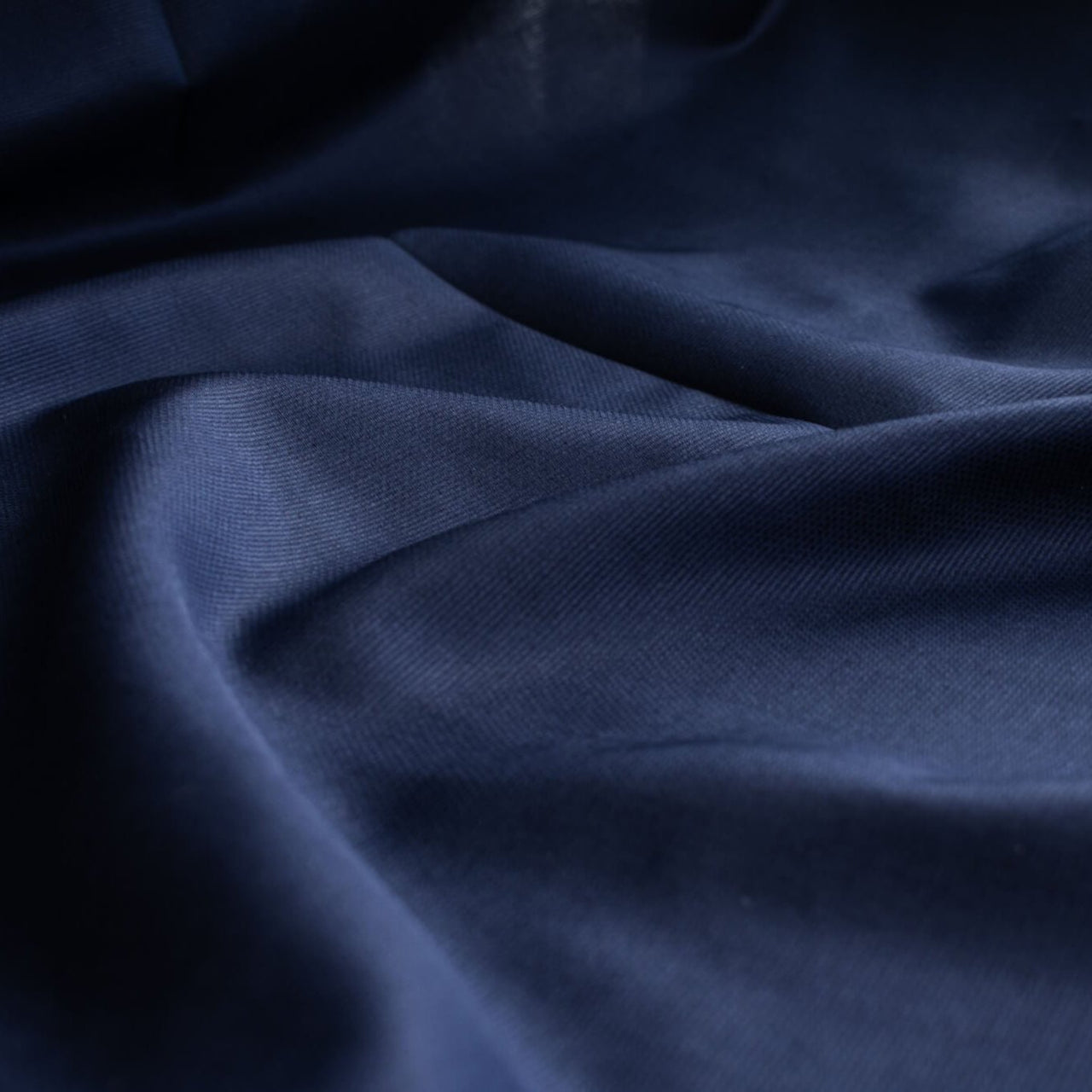 Fine Egyptian Pima Cotton Pique Shirting fabric by the yard. Imported from Switzerland, our fabric boasts a luxurious cotton that is semi-sheer and has a soft, semi-crisp hand. Perfect for a high-end and comfortable shirt, dress, skirt or top!  Close up image.