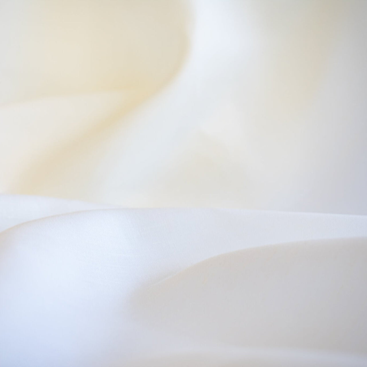 NYC Designer Linen blend designer deadstock fabric by the yard is the perfect fabric if you just love linen. &nbsp;A plain weave off-white fabric with a soft, slightly crisp hand.  Close up glamour image.
