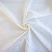 NYC Designer Linen blend designer deadstock fabric by the yard is the perfect fabric if you just love linen. &nbsp;A plain weave off-white fabric with a soft, slightly crisp hand.  Image of fabric fullness.
