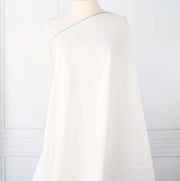 NYC Designer Linen blend designer deadstock fabric by the yard is the perfect fabric if you just love linen. &nbsp;A plain weave off-white fabric with a soft, slightly crisp hand.  Image of fabric draped on dressform.
