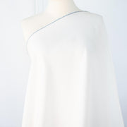 NYC Designer Linen blend designer deadstock fabric by the yard is the perfect fabric if you just love linen. &nbsp;A plain weave off-white fabric with a soft, slightly crisp hand.  Image of draped fabric on dressform.