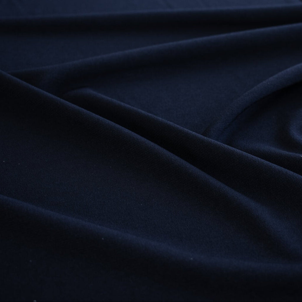 Designer ITY Solid Jersey Knit designer deadstock fabric by the yard. Perfect for travelwear, this ITY is sophisticated and elegant. The perfect choice for your next sewing project. Close up image.