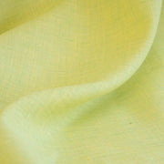Made of 100% linen, this shirt-weight fabric features a gentle blend of spring green, white, and soft yellow tones, perfect for a stylish shirt, dress or skirt. Enjoy the lightweight, soft semi-crisp hand of this cross-dyed, woven fabric. Close up image.