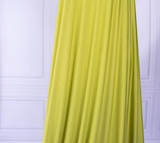  Designer citrus green 4-way stretch knit fabric draped on dressform.