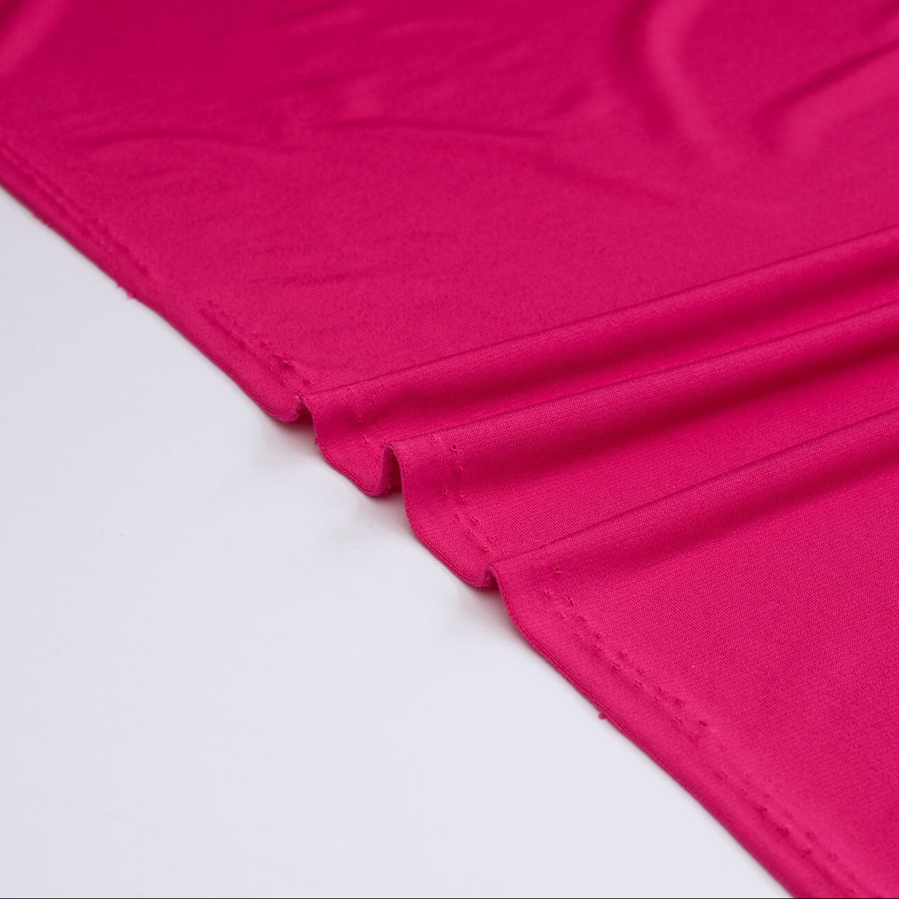 Close-up of Korean Dark Pink Polyester/Spandex ITY Knit fabric.