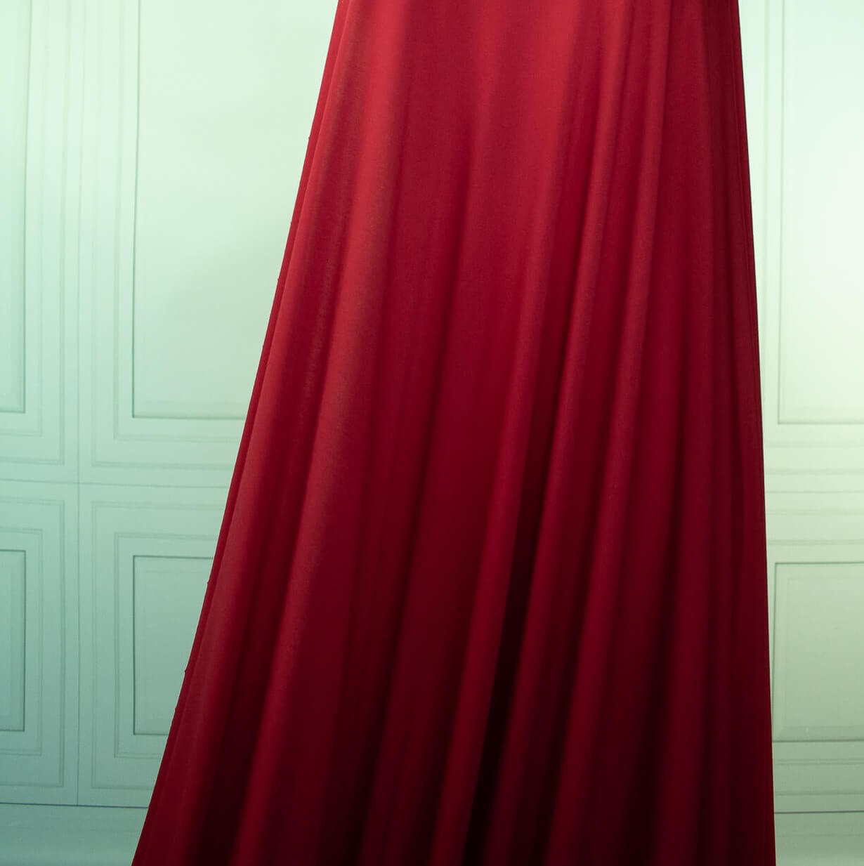 Warm red ITY jersey fabric draped on dressform