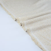 Close up of selvedge  - 
Designer White and Gold Metallic Designer Sweater knit fabric by the yard. 