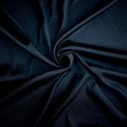 Dark blue silk twill  fabric with a swirl to demonstrate fabric body
