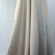  Image of tan/white 100% linen mid-weight woven fabric on dressform to demonstrate drape.