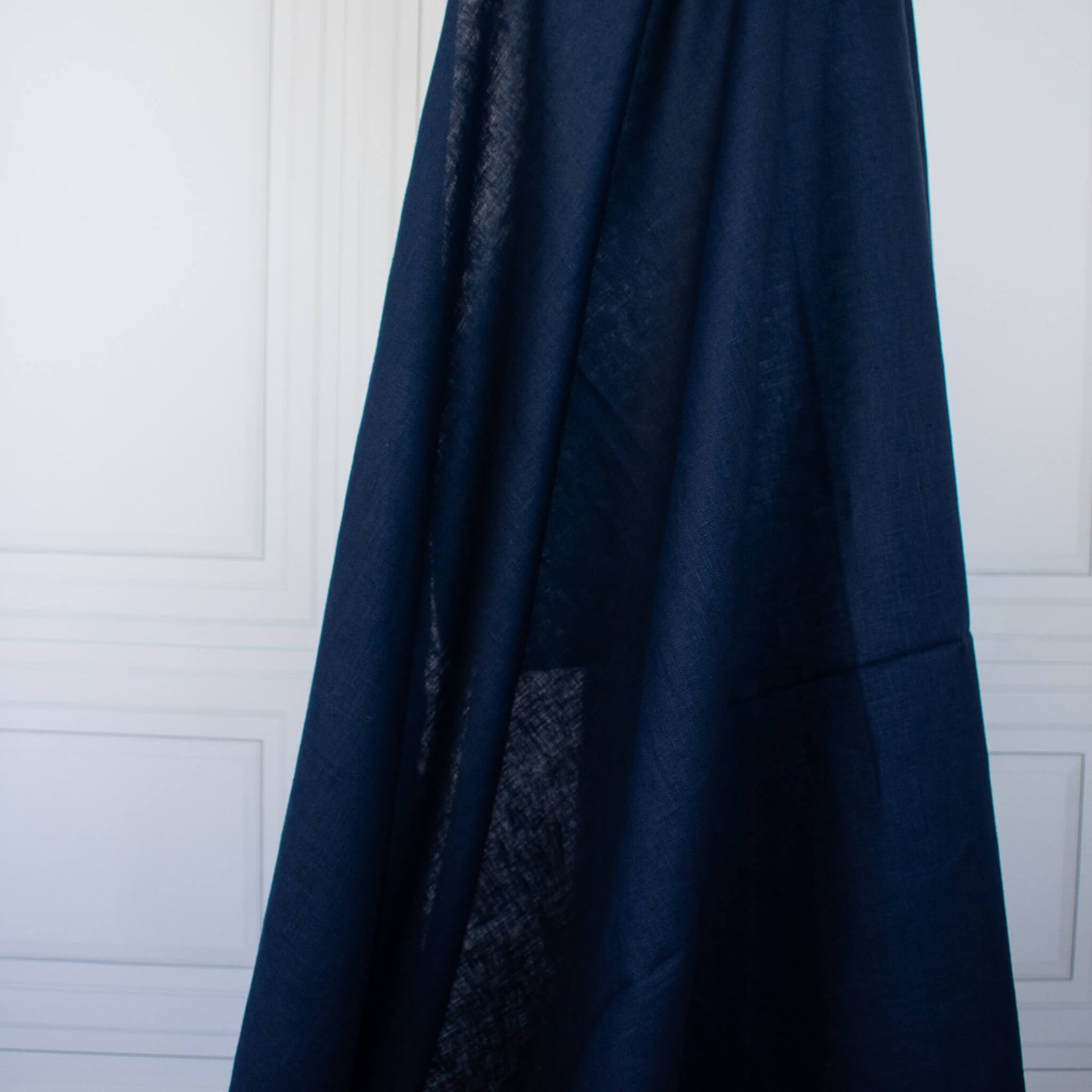 Dark Blue linen fabric draped on dressform.