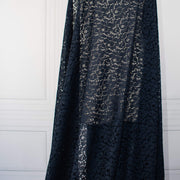 Blue lace Designer fabric draped on dressform.  