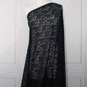 Blue lace Designer fabric draped on dressform.  