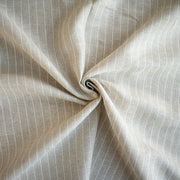 European Mid-Weight 100% Linen Stripe Herringbone Weave fabric twisted to demonstrate fullness.