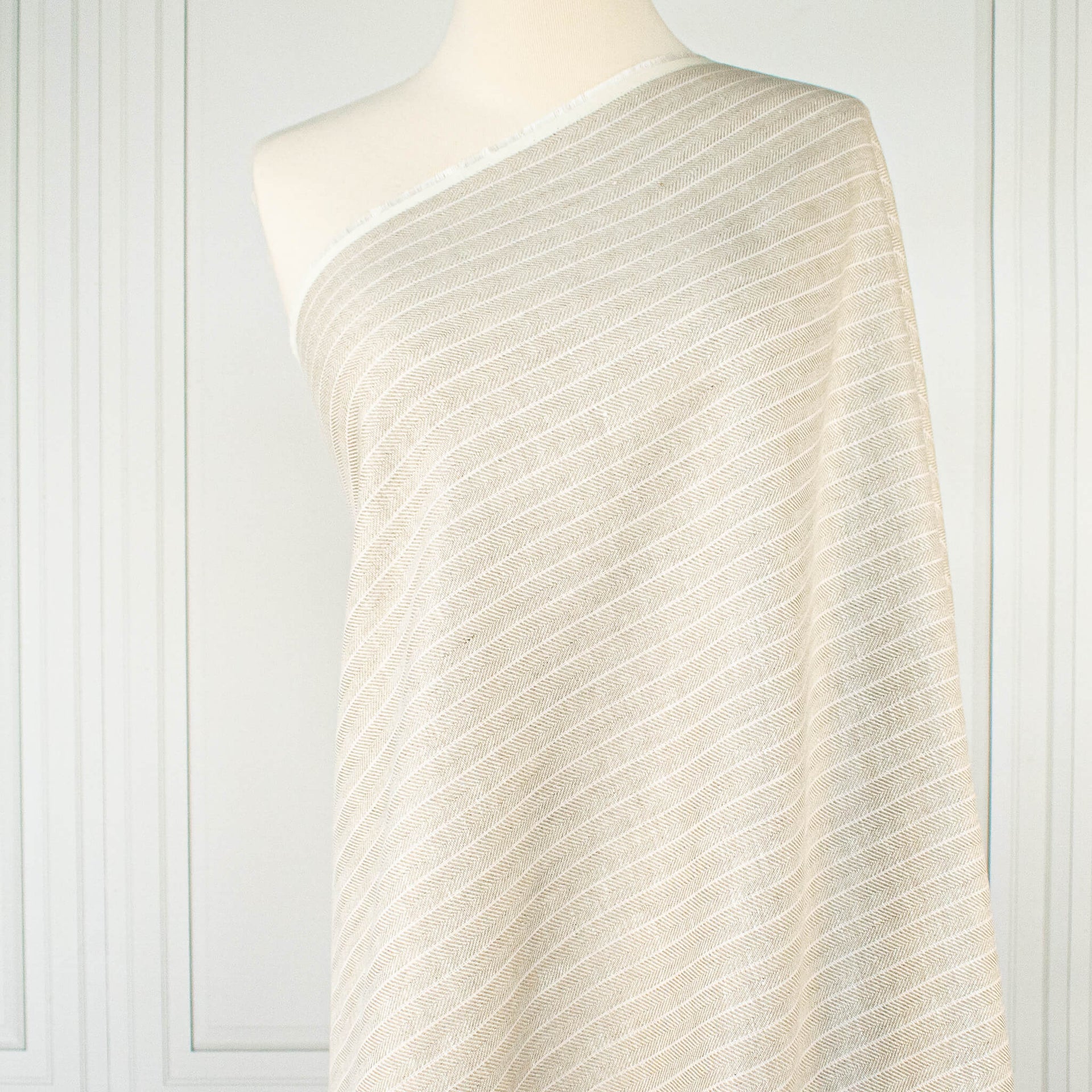 European Mid-Weight 100% Linen Stripe Herringbone Weave fabric draped on dressform.