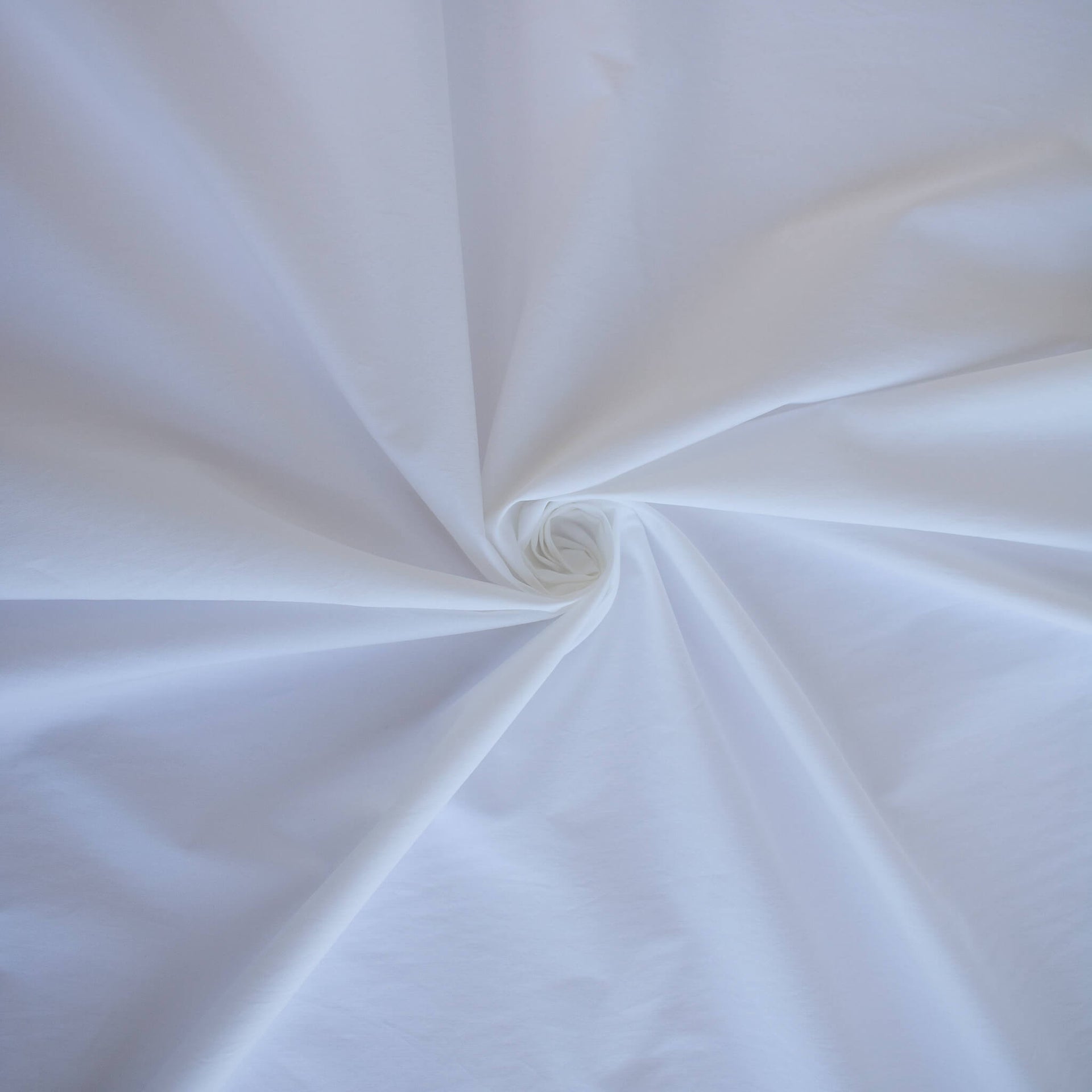 Close-up of white NYC designer shirting fabric 
