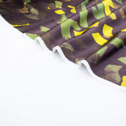 A close-up image of  Italian viscose sateen  fabric selvedge set against a plain white background.