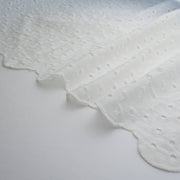 Image of  Italian Cotton San Gallo Lace in soft white, a delicate broderie anglaise fabric selvedge