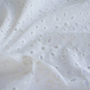 Image of  Italian Cotton San Gallo Lace in soft white, a delicate broderie anglaise fabric by the yard. 