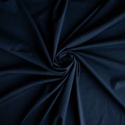 Couture Italian wool and linen blend navy gabardine fabric draped in a spiral pattern to demonstrate fullness