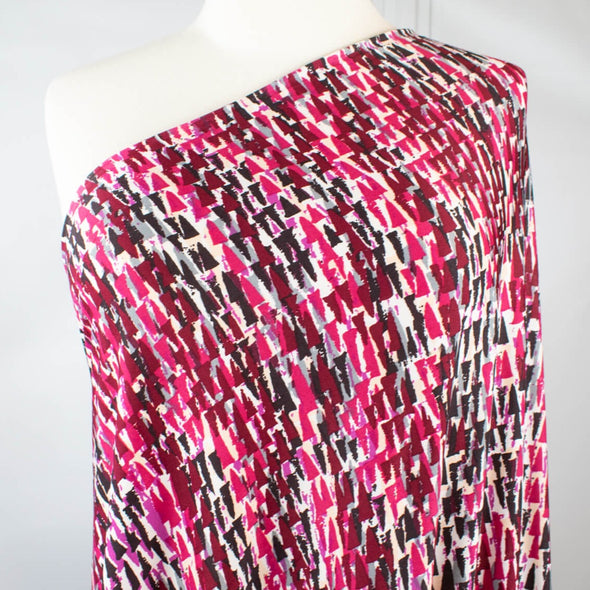 Modern and fabulous, that's how you'll look in this abstract DTY print.  Perfect for a wrap dress or top that is pure sophistication!  DTY is a double twisted yard which is not as thin as an ITY knit.  It has a soft touch, drapes nicely, and is easy to sew. Image of fabric on dressform.