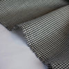 Reminiscent of 90's fashion this black and white tropical weight wool houndstooth is a true classic.  Can you picture the cutest straight skirt or very fashionable wide leg pant.  The tropical weight means you have the wear of a woolen and it is light enough to wear thorough each season. Image of selvedge edge.