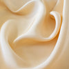 Couture Designer 4-Ply Silk in an ivory buttercream is a premium medium weight silk and is so glamorous! Luxurious and elegant with a soft sheen and gentle drape. A fine smooth hand feels buttery on the skin, perfect for draped, fitted, or fuller styles perhaps a wide leg pant, vest, jacket, or dress!   Close up image.