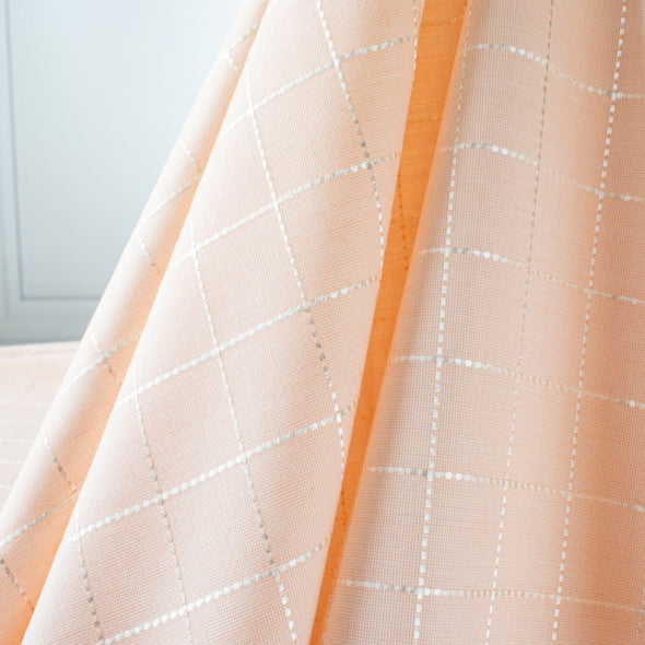 soft peach suiting.  Made in Italy, this Beverly Hills Couture designer deadstock fabric is just lovely for Spring.  image of fabric drape