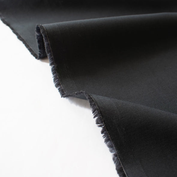 Curated from a LA design house which specializes in luxurious minimalist fashion, this cotton suiting will have you feeling sophisticated and confident.  Create your own little black dress for Spring and Summer! Image of selvedge