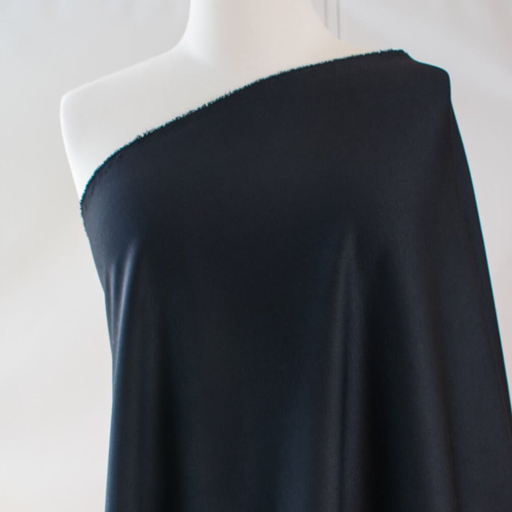 Transform this high-end designer Ponte knit into pure fabulous.  Whether you have a little black dress in mind, a pencil skirt, or jacket you'll exude confidence and sophistication when you walk in the room. You'll love the soft touch of the fabric and the comfort of it's stretch. Image of fabric on dressform.