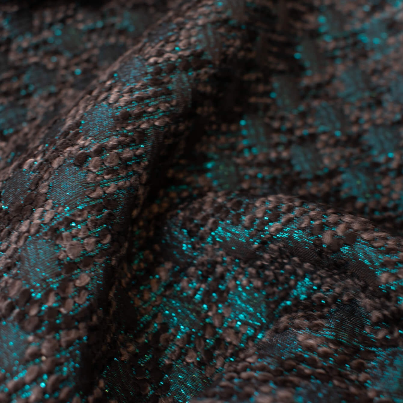 High End Designer Label Brocade Boucle in a stunning Cyan Blue, Black and Charcoal  A textured fabric with a soft hand. The metallic threads create a stunning statement piece!   Close up image.