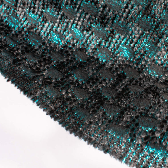 High End Designer Label Brocade Boucle in a stunning Cyan Blue, Black and Charcoal  A textured fabric with a soft hand. The metallic threads create a stunning statement piece!  Image of selvedge edge.