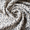 This NYC designer boucle just made my dreams come true! A soft boucle of looping curls imported from Italy will have you imaging you stepped off the runway! Ideal for the French Jacket you're just itching to make! Photo of fabric twirled to demonstrate weight and flow.