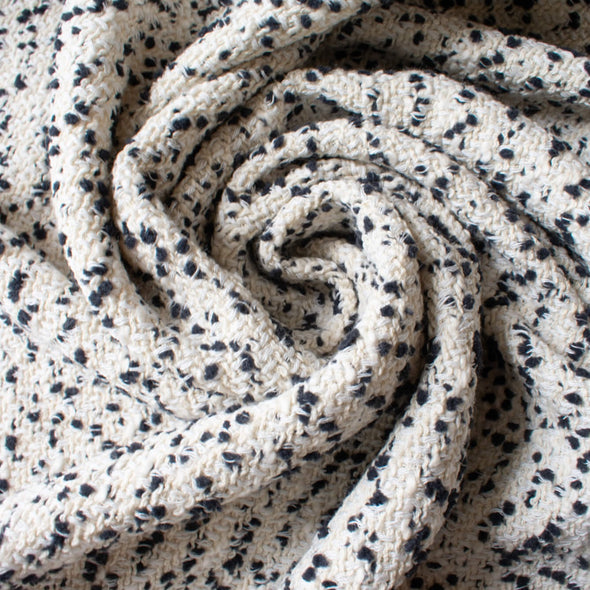 This NYC designer boucle just made my dreams come true! A soft boucle of looping curls imported from Italy will have you imaging you stepped off the runway! Ideal for the French Jacket you're just itching to make! Photo of fabric twirled to demonstrate weight and flow.