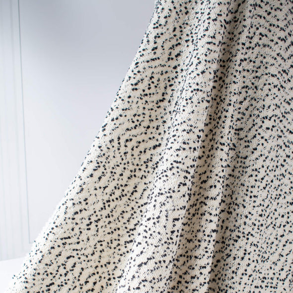 This NYC designer boucle just made my dreams come true! A soft boucle of looping curls imported from Italy will have you imaging you stepped off the runway! Ideal for the French Jacket you're just itching to make! Photo of fabric drape.