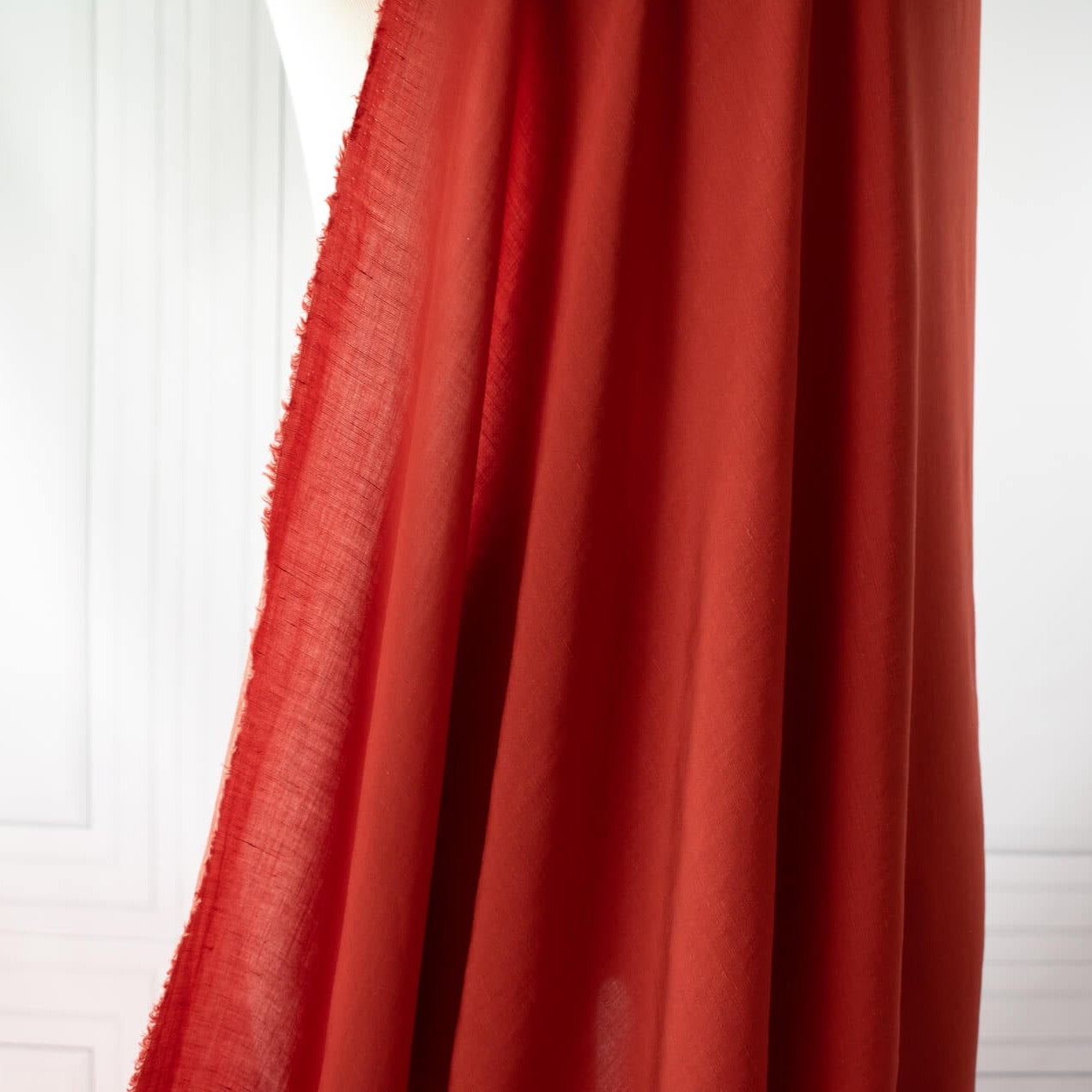 Richly saturated in color, this linen blend has a soft, textured hand and the familiar drape of rayon. Make up a gorgeous top, dress or skirt that stands out!  Translucent with a pleasing slubbed texture, may need lining for dresses and skirts. image of fabric drape.