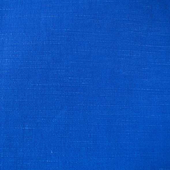 You'll be feeling the summer vibes in this Polynesian blue linen blend.  It has a soft, textured hand and the familiar drape of rayon. Make up a gorgeous top, dress or skirt that stands out!  Translucent with a pleasing slubbed texture, may need lining for dresses and skirts. Close up image of fabric texture.