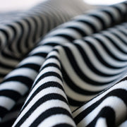 Capture your inner French style with this incredibly soft closely knitted horizontal stripe Ponte from a NYC designer. Imported from Italy, this is such a pleasure to sew especially if you are just starting out with knits! With it's generous width, sew up your favorite top, skirt, dress or cardigan. Close up photo.