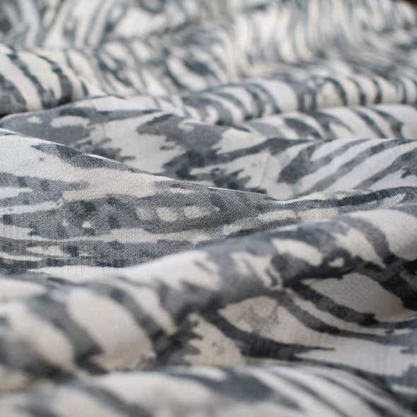 Close up photo of soft animal print in a sophisticated palette of eggshell and shades of grey from a Los Angeles designer.