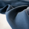 Close up photo of elegant navy crepe from a Los Angeles designer. Designer deadstock fabric.