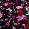 Create something stunning with this Designer Silk Crepe de Chine in florals of pinks, red, white, burgundy and grey upon a black background. Photo depicts floral pattern