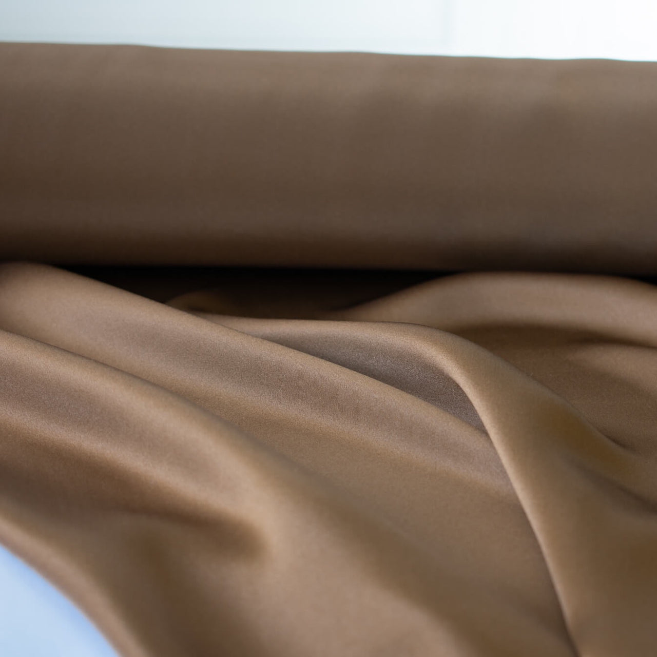 Indulge yourself in the luster of 100% Silk Charmeuse from a NYC Designer. A popular fabric for creating fluid bias cut garments and luxurious lining to your special pieces like the French Jacket. Close up photo of fabric fluidity.