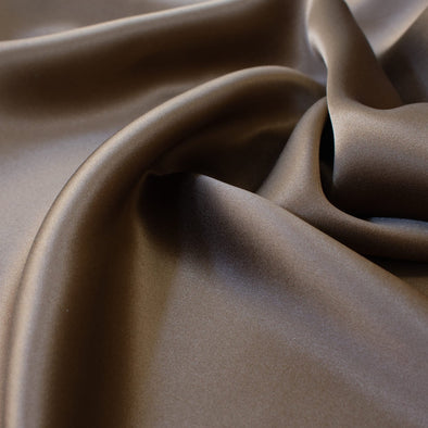 Indulge yourself in the luster of 100% Silk Charmeuse from a NYC Designer. A popular fabric for creating fluid bias cut garments and luxurious lining to your special pieces like the French Jacket. Close up photo of fabric fluidity.