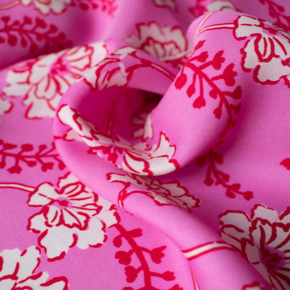 Designer Deadstock Silk Crepe de Chine Dark Pink Background with creme colored flowers and small red buds -close up